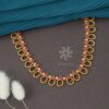 gold toned temple necklace