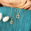 gold toned necklace with pendant
